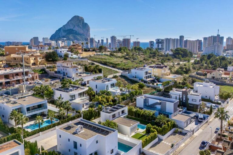 Aerial view across Calpe towards the Peñón de Ifach, close to a modern oasis villa near Arenal-Bol Beach.