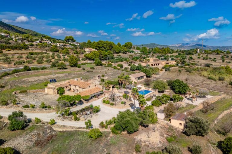 Aerial view of a historic finca in Benissa with private grounds, pool, countryside setting and surrounding valley landscape
