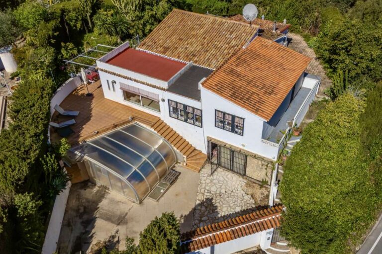 Aerial view of a Mediterranean villa in Benissa Costa near Cala Baladrar with covered swimming pool, terraces and mature garden