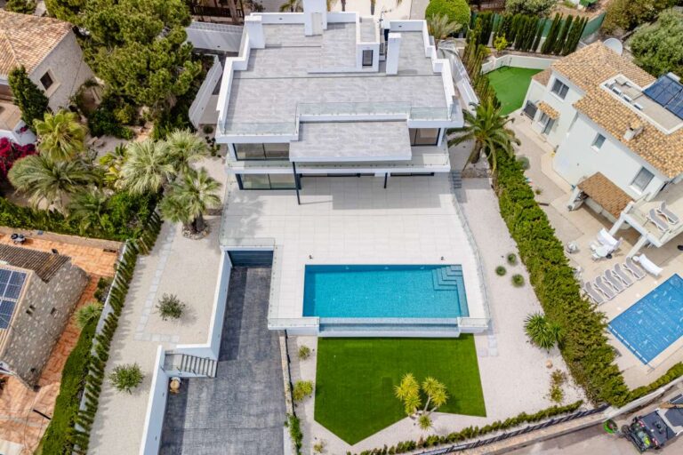 Aerial view of a modern second-line sea villa in La Calalga, Calpe with private pool, landscaped garden and coastal setting