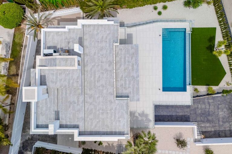 Aerial view of a modern second-line sea villa in La Calalga, Calpe with private pool, terraces and landscaped garden
