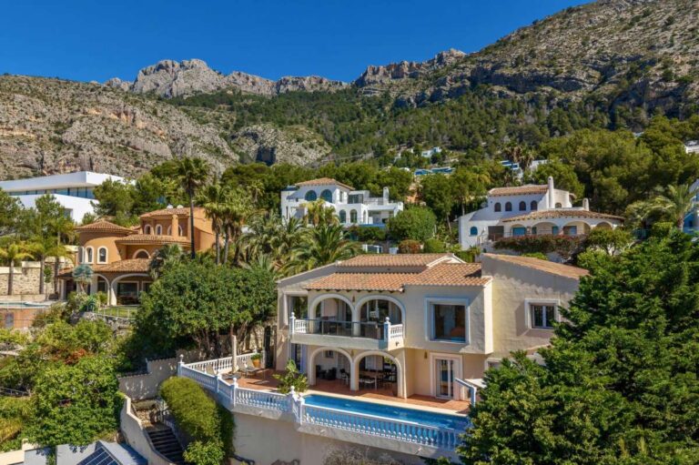 Aerial view of an elegant Mediterranean villa in Altea Hills with private pool, panoramic terrace and surrounding mountain views