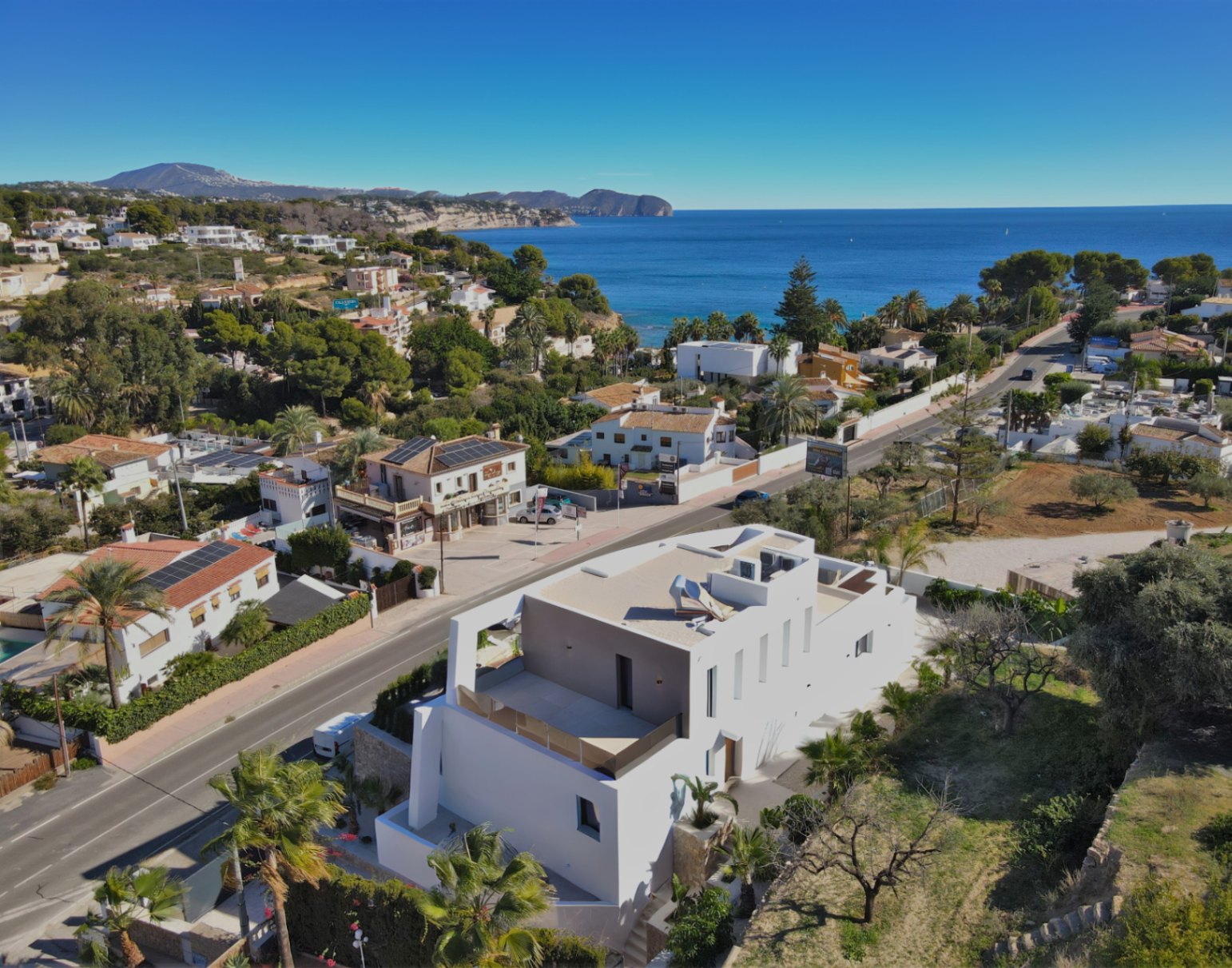 Aerial view of luxury villa near La Fustera Beach with sea views
