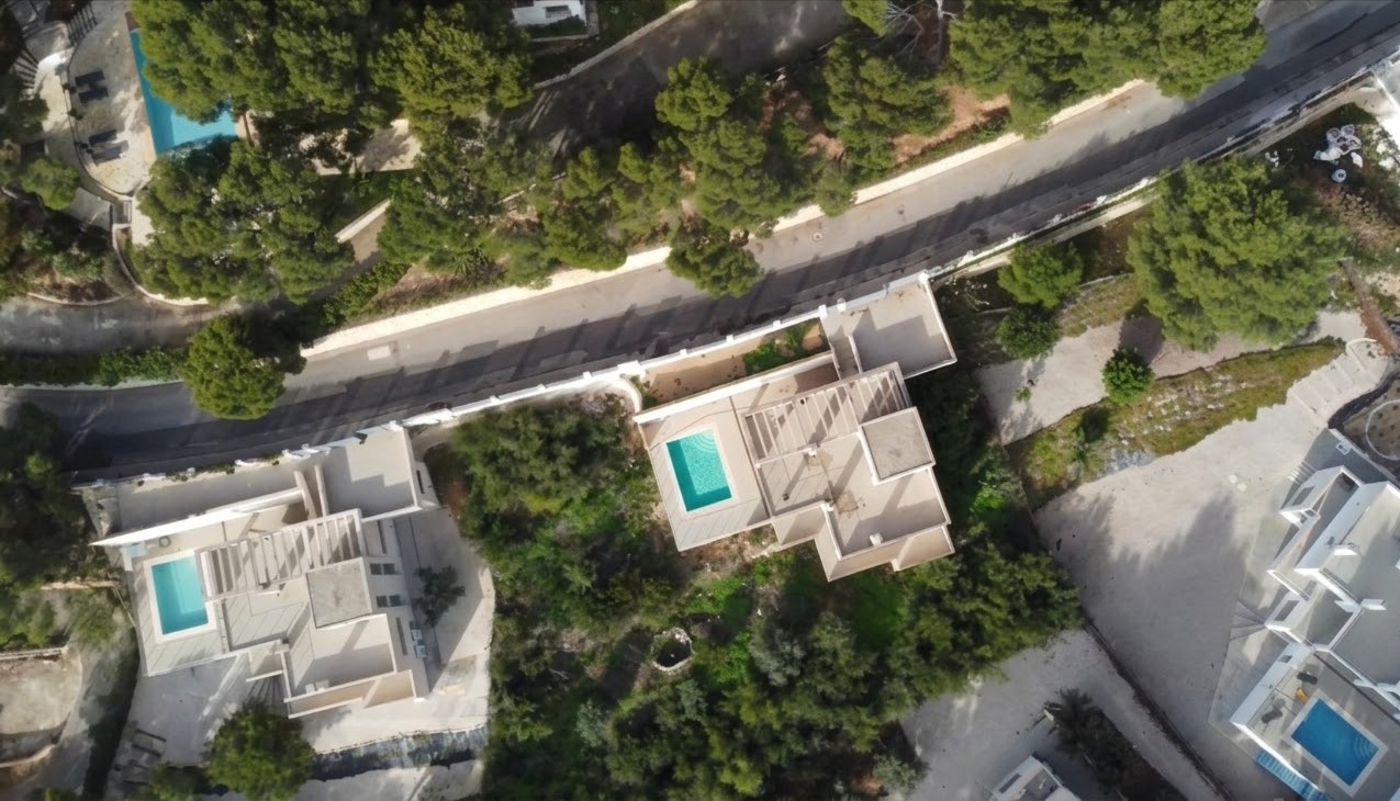 Aerial view of luxury villa plot with private pool in Altea