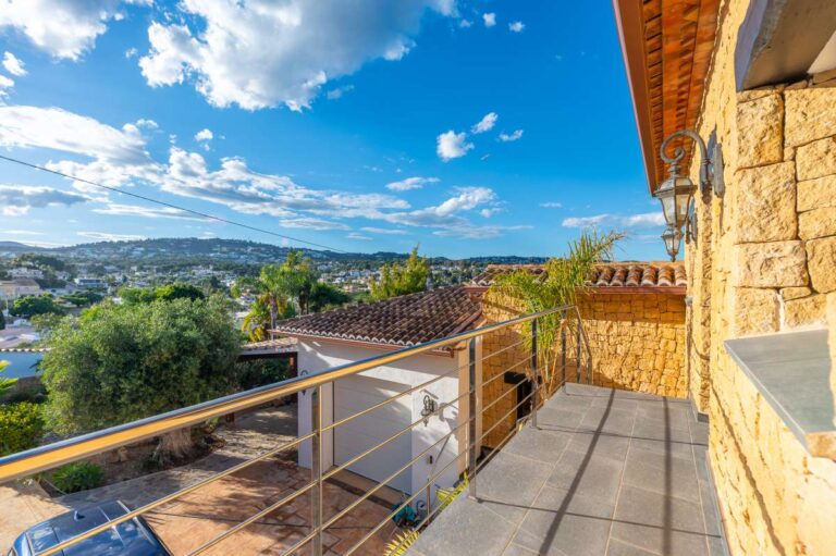 Balcony at a premium coastal villa on the Benissa Costa with stone exterior, open views, surrounding greenery and Mediterranean setting