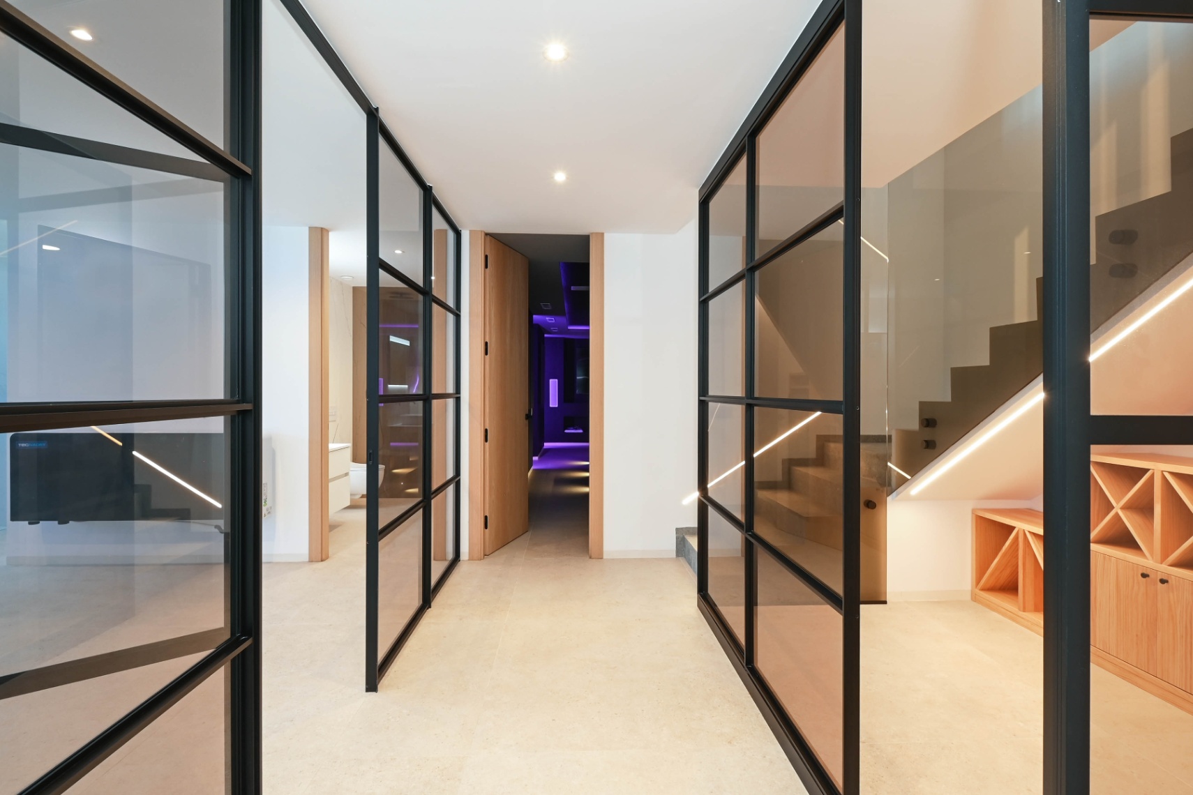 Basement hallway leading to leisure spaces at luxury villa in Benissa