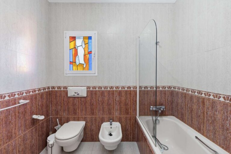 Bathroom with bath, shower, toilet, and bidet inside a villa in Calpe.