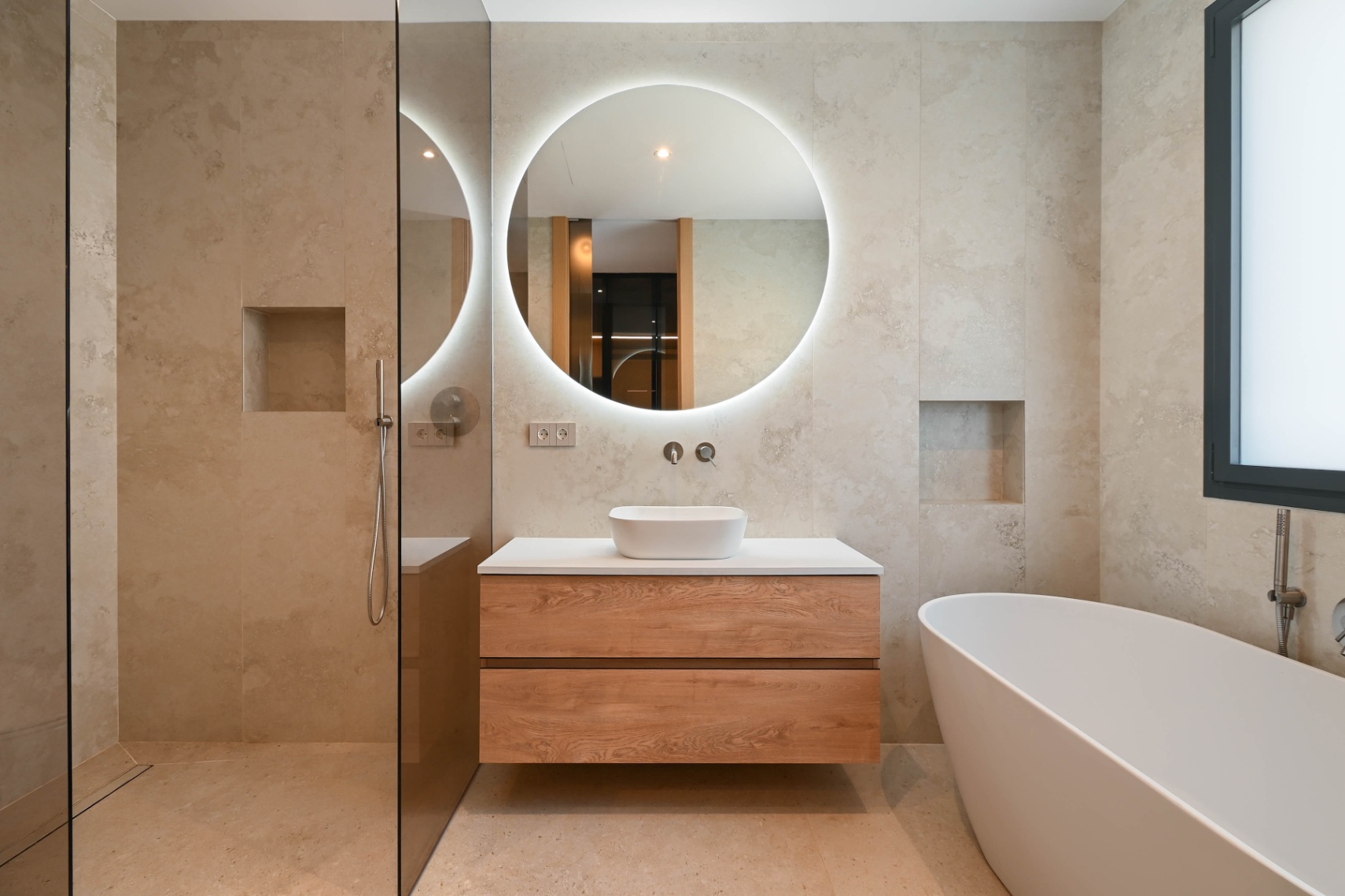 Bathroom with bathtub and modern vanity at luxury villa near La Fustera Beach