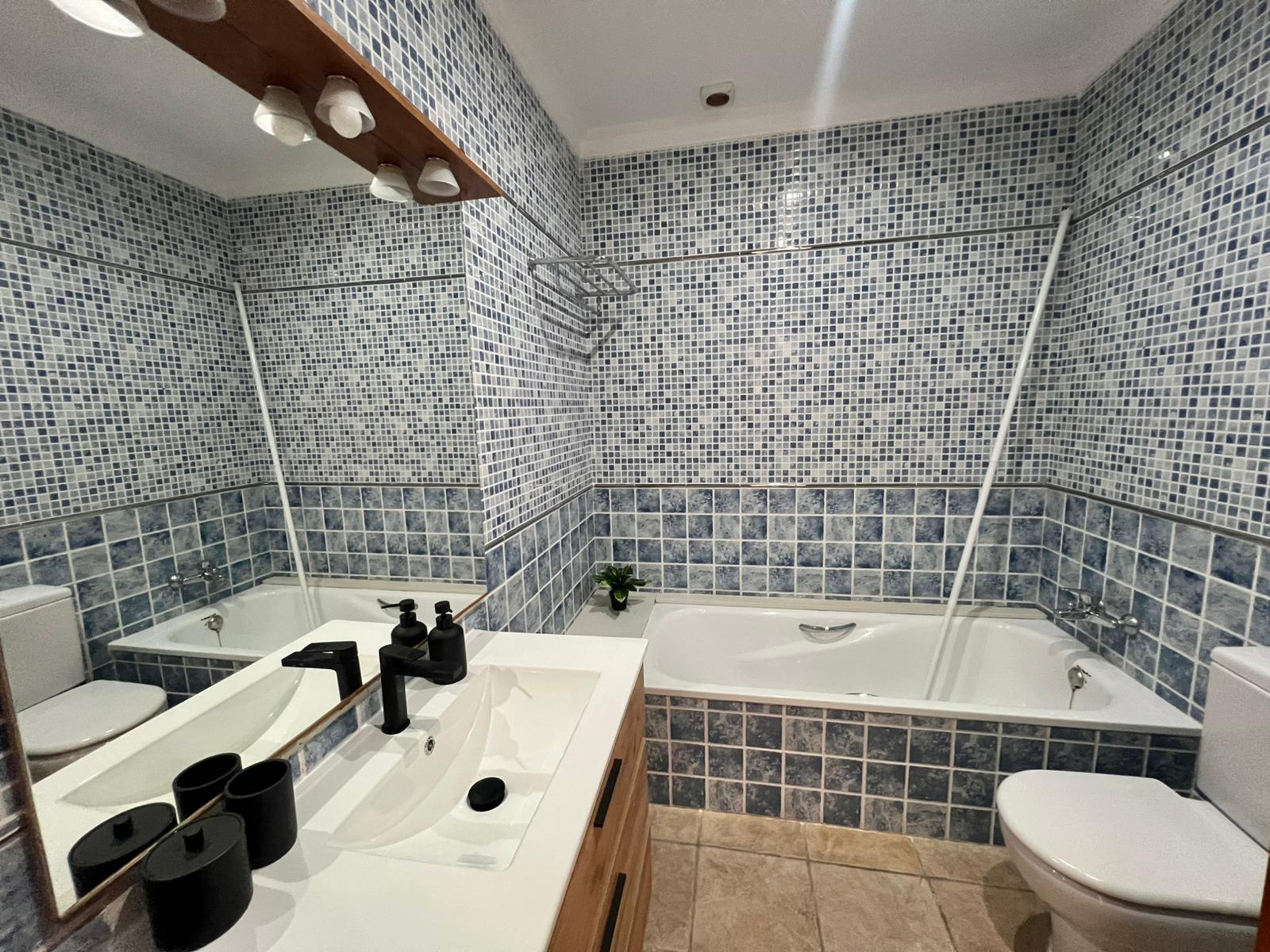 Bathroom with bathtub at modern three-level villa in Moraira