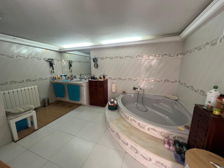 Bathroom with corner bath at Mediterranean villa in Buena Vista Benissa