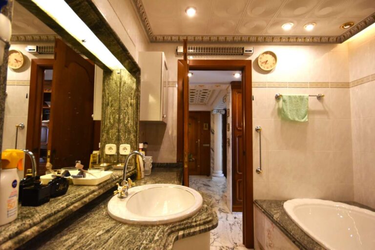 Bathroom with vanity, bath and quality finishes inside a frontline double penthouse for sale on Arenal Beach in Calpe.