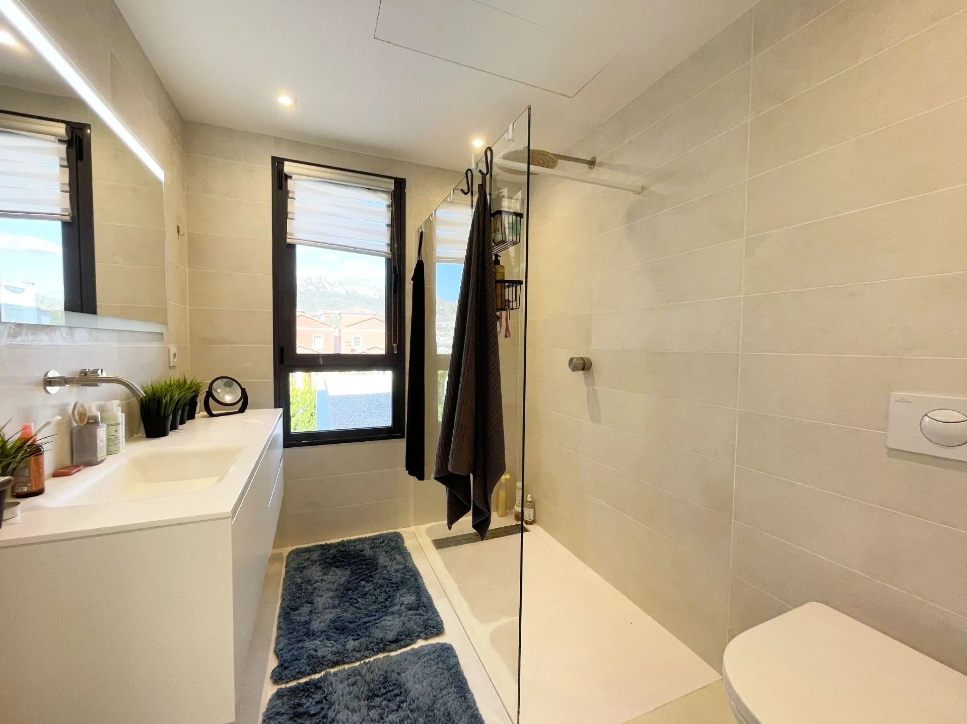Bathroom with walk-in shower at modern villa in Calpe