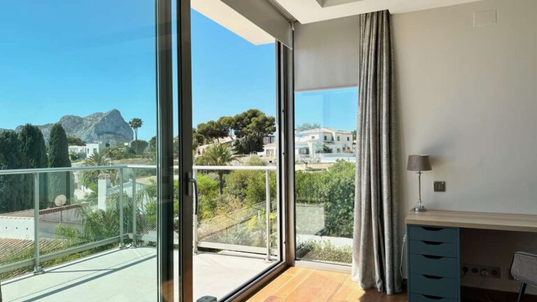 Bedroom balcony at a modern luxury villa in La Calalga, Calpe with sea views, glass railing and views towards the Peñón de Ifach