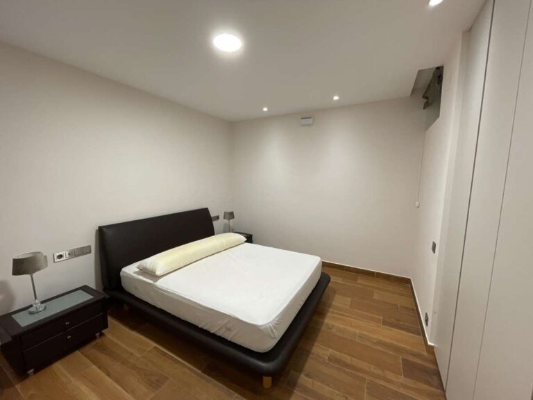 Bedroom inside a modern luxury villa in La Calalga, Calpe with fitted wardrobes, wooden flooring and simple contemporary finish