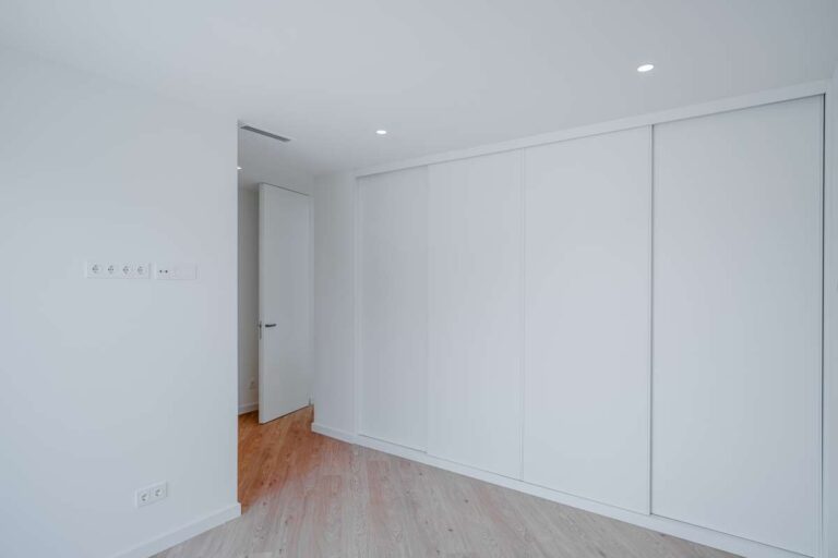 Bedroom inside a modern villa in La Calalga, Calpe with fitted wardrobes, wood flooring and bright contemporary finish