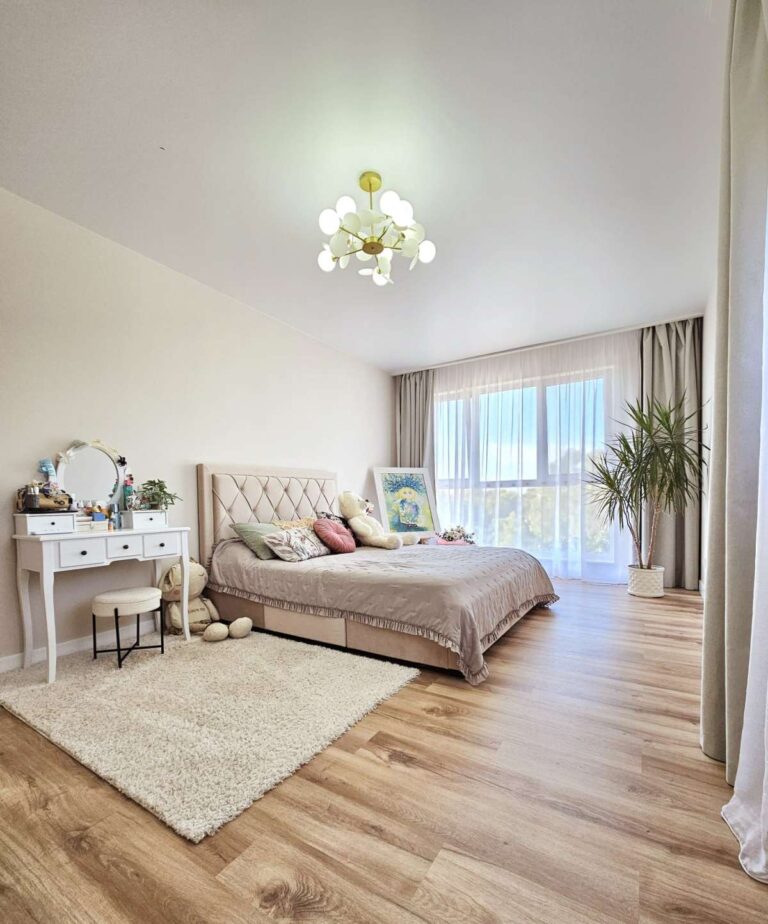 Bedroom inside a modern villa near Les Bassetes, Calpe with dressing table, large window and bright interior