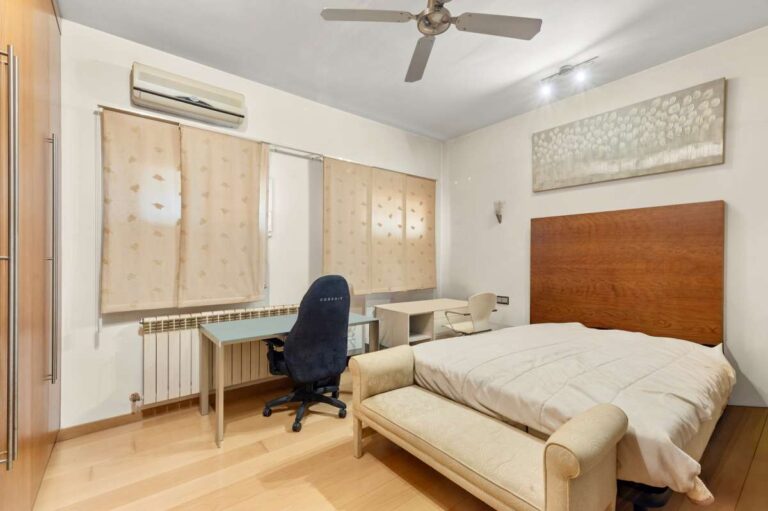 Bedroom inside a private villa in Calpe with desk area, seating, air conditioning and natural light