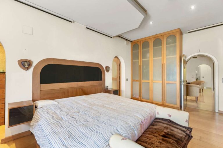 Bedroom inside a private villa in Calpe with fitted wardrobes, dressing area, en-suite access and natural light