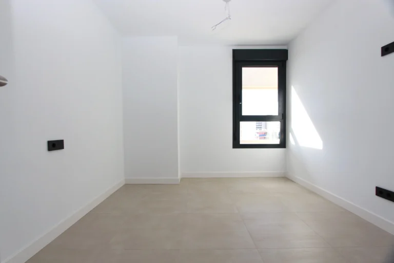 Bright bedroom inside modern luxury penthouse in Calpe