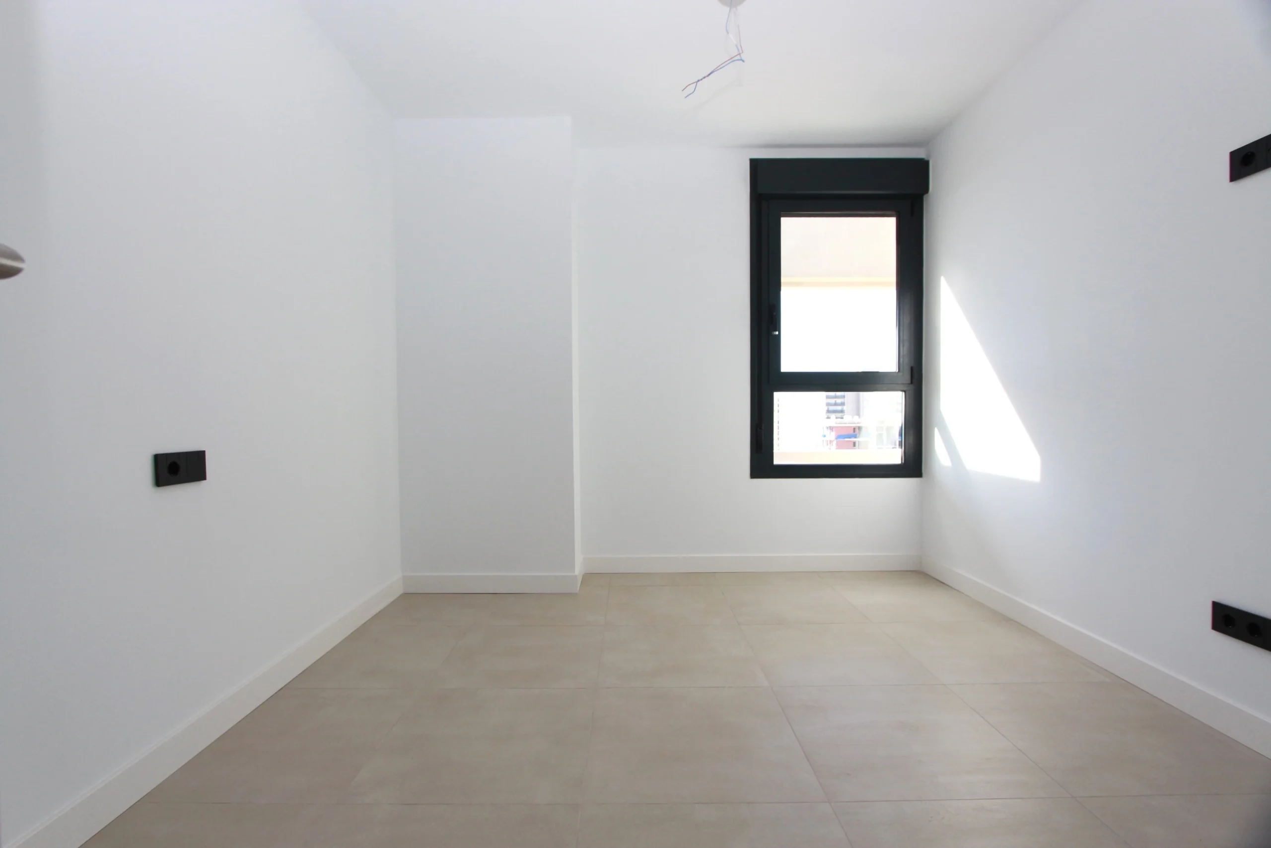 Bright bedroom inside modern luxury penthouse in Calpe