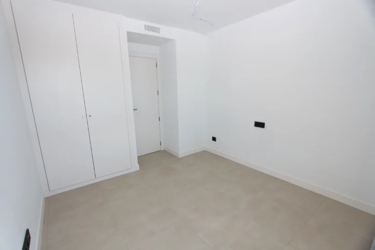 Bedroom with built-in wardrobes inside luxury penthouse in Calpe`