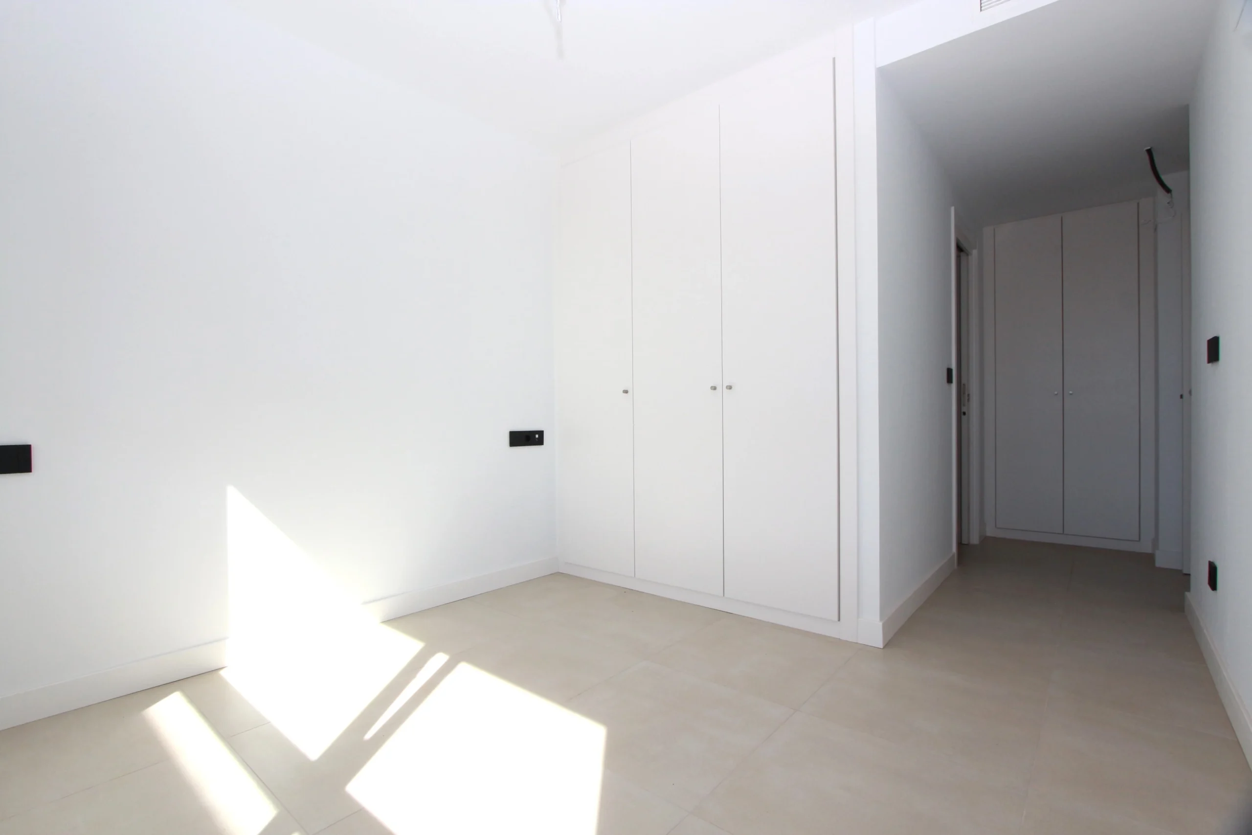 Bedroom with built-in wardrobes inside modern penthouse in Calpe`