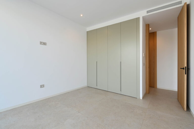 Bedroom with fitted wardrobes at newly built luxury villa in Benissa
