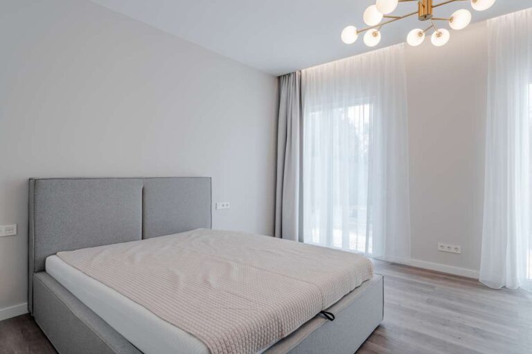 Bedroom with large window inside a new build three bedroom villa for sale in Calpe near the coast