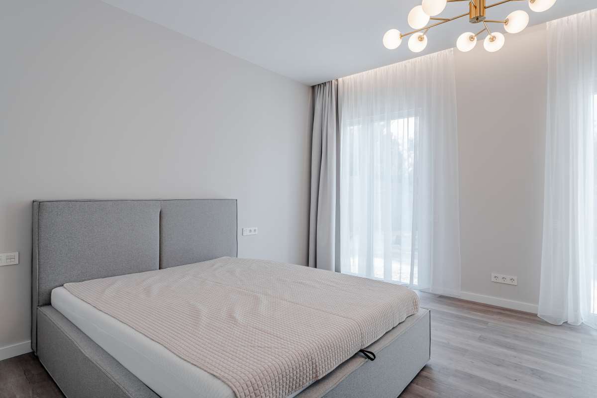Bedroom with large window inside a new build three bedroom villa for sale in Calpe near the coast