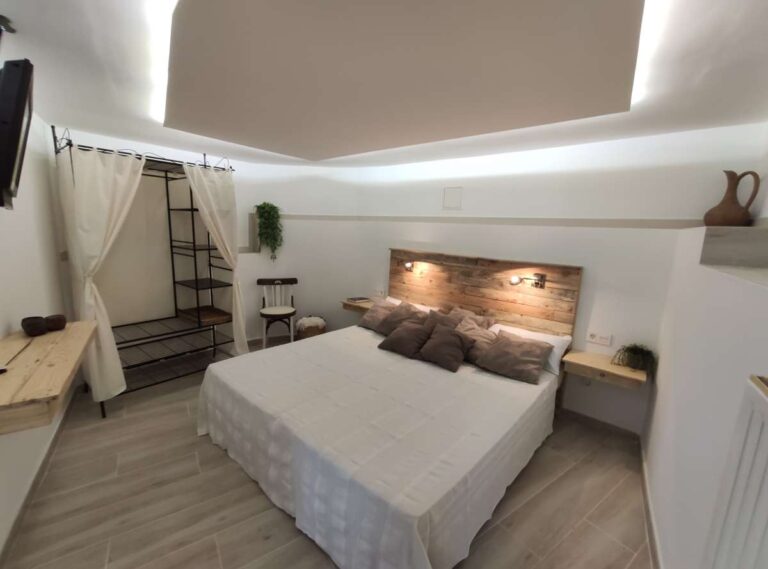Bedroom with modern lighting and neutral finishes inside a refurbished villa with sea views in Canuta, Calpe.