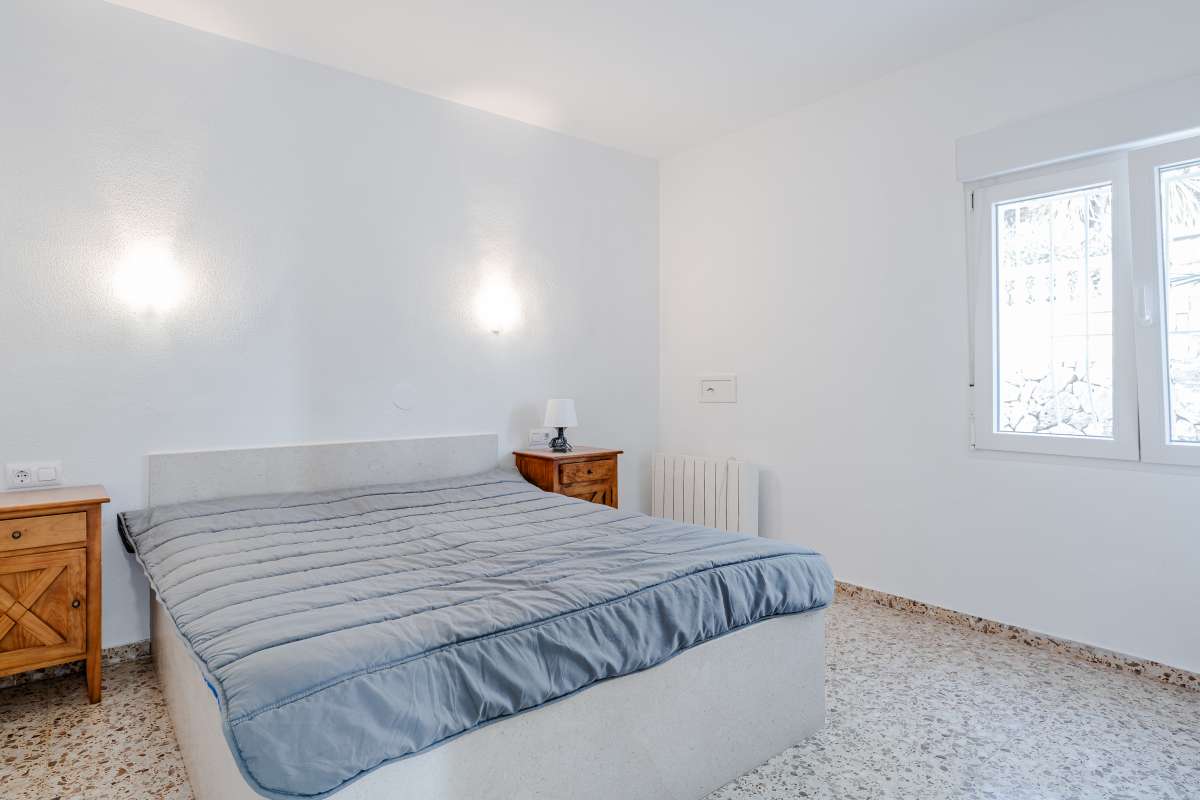 Bedroom with natural light and neutral finishes inside a Mediterranean villa in Maryvilla, Calpe.