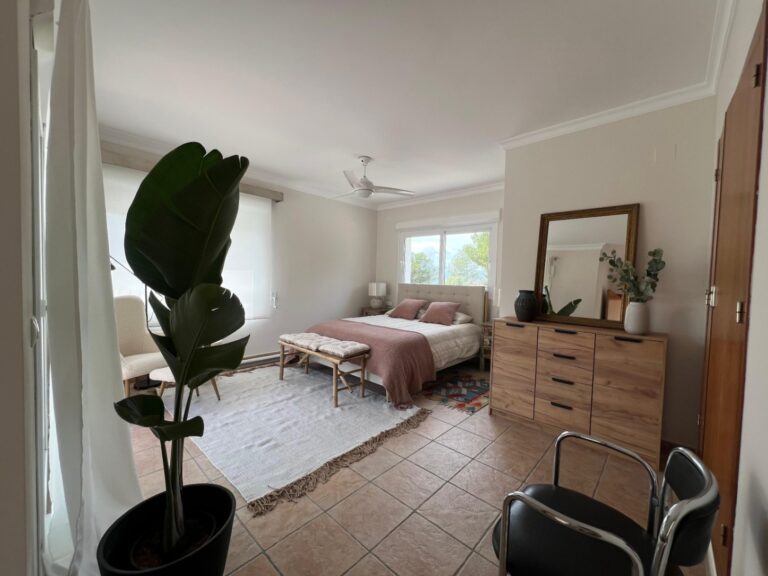 Bedroom with seating area at modern villa in Moraira