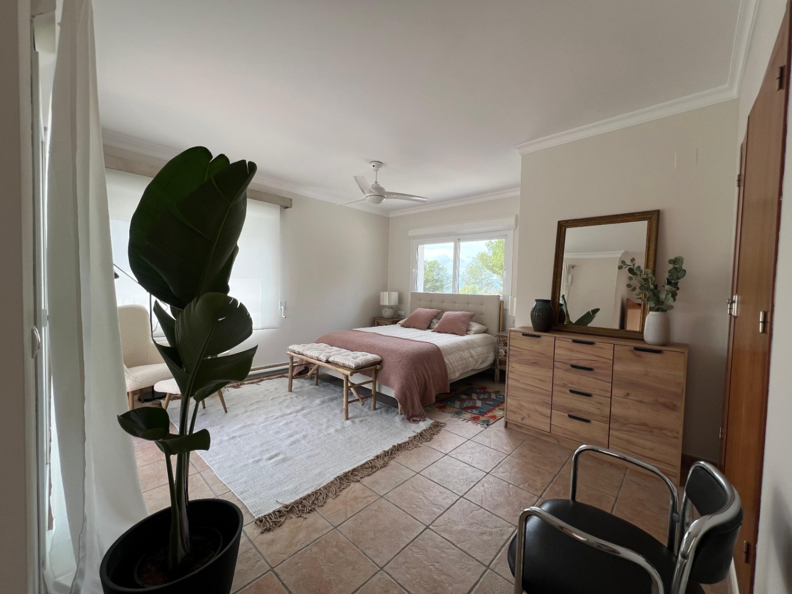 Bedroom with seating area at modern villa in Moraira