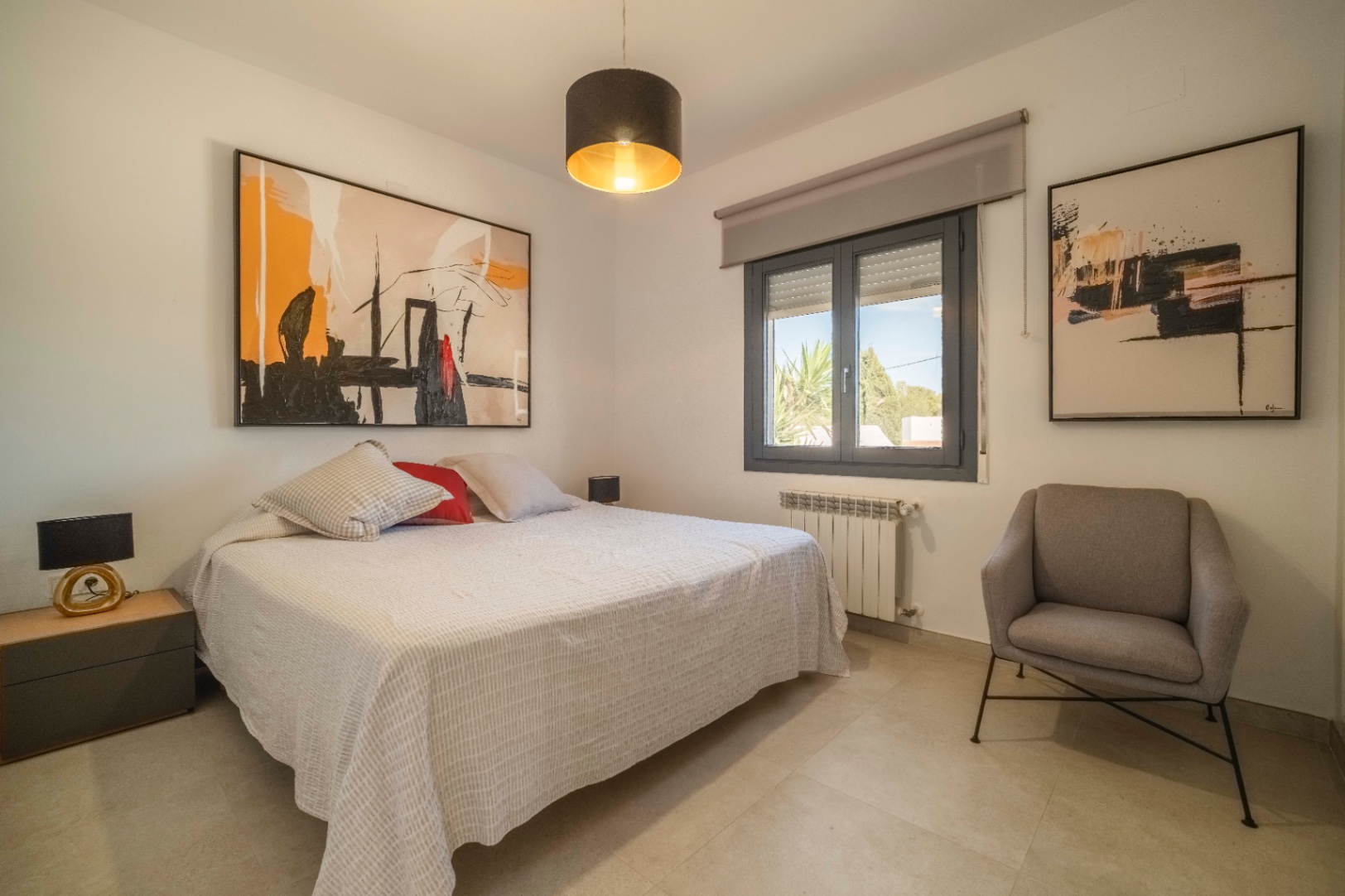 Bedroom with seating area at renovated villa in Calpe