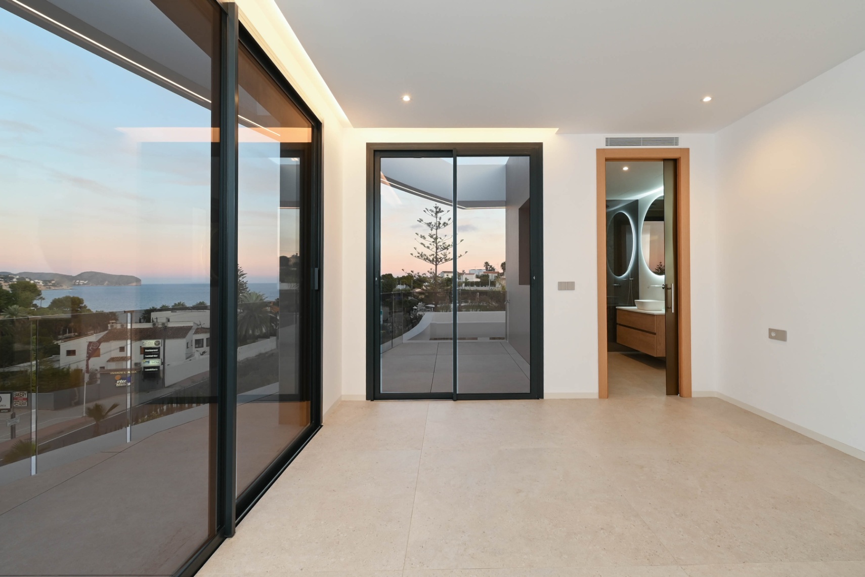 Bedroom with terrace access and sea views at luxury villa in Benissa