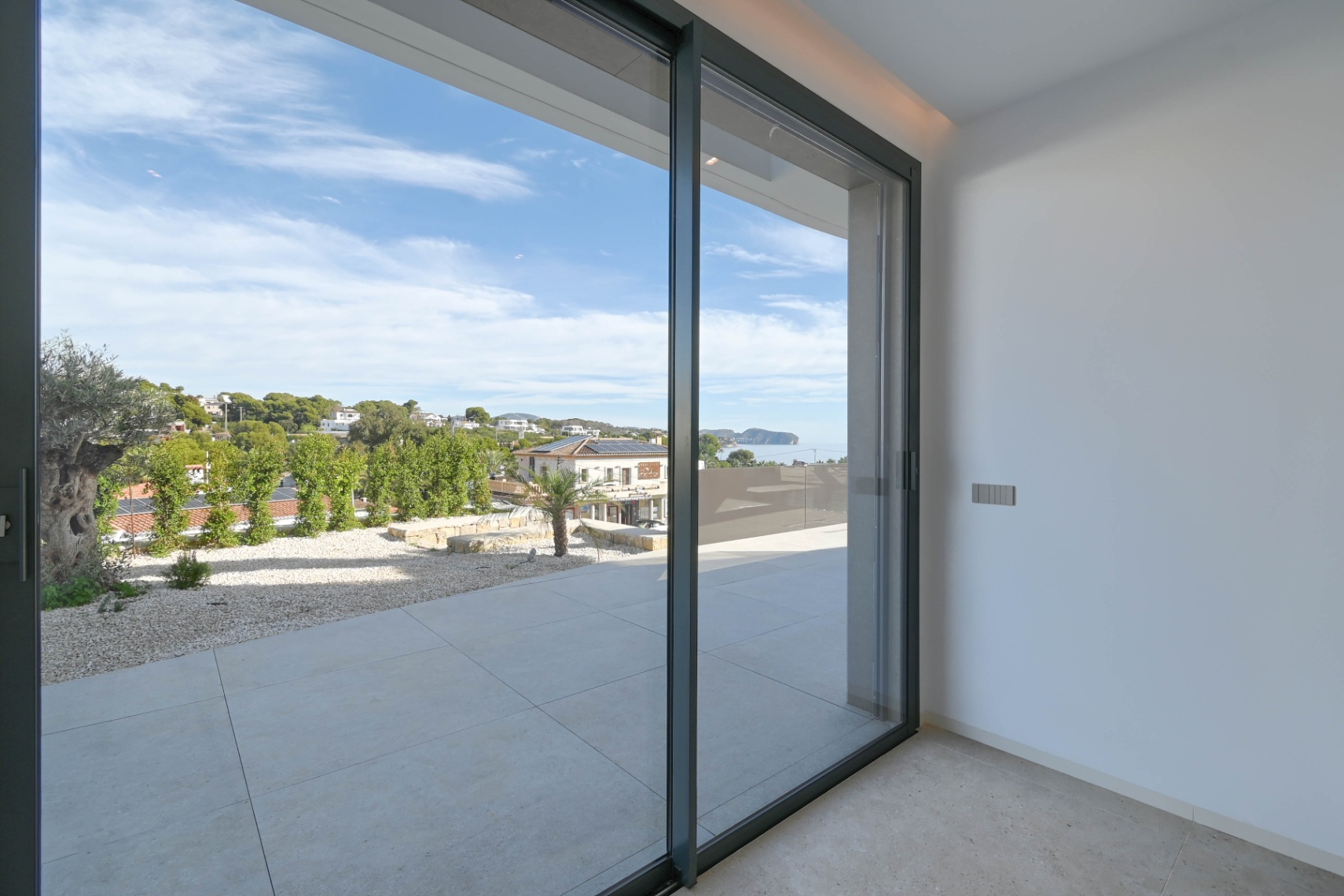 Bedroom with terrace access at luxury villa near La Fustera Beach