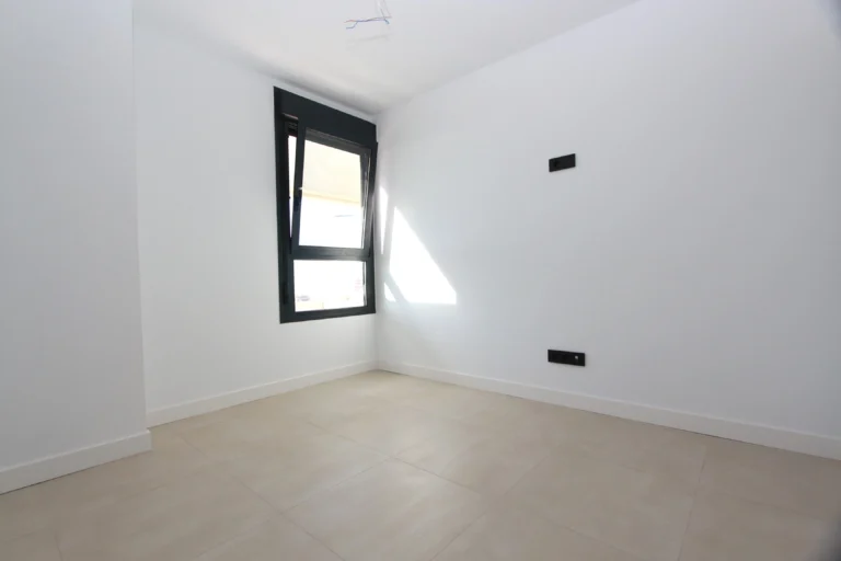 Bright bedroom inside modern luxury penthouse in Calpe