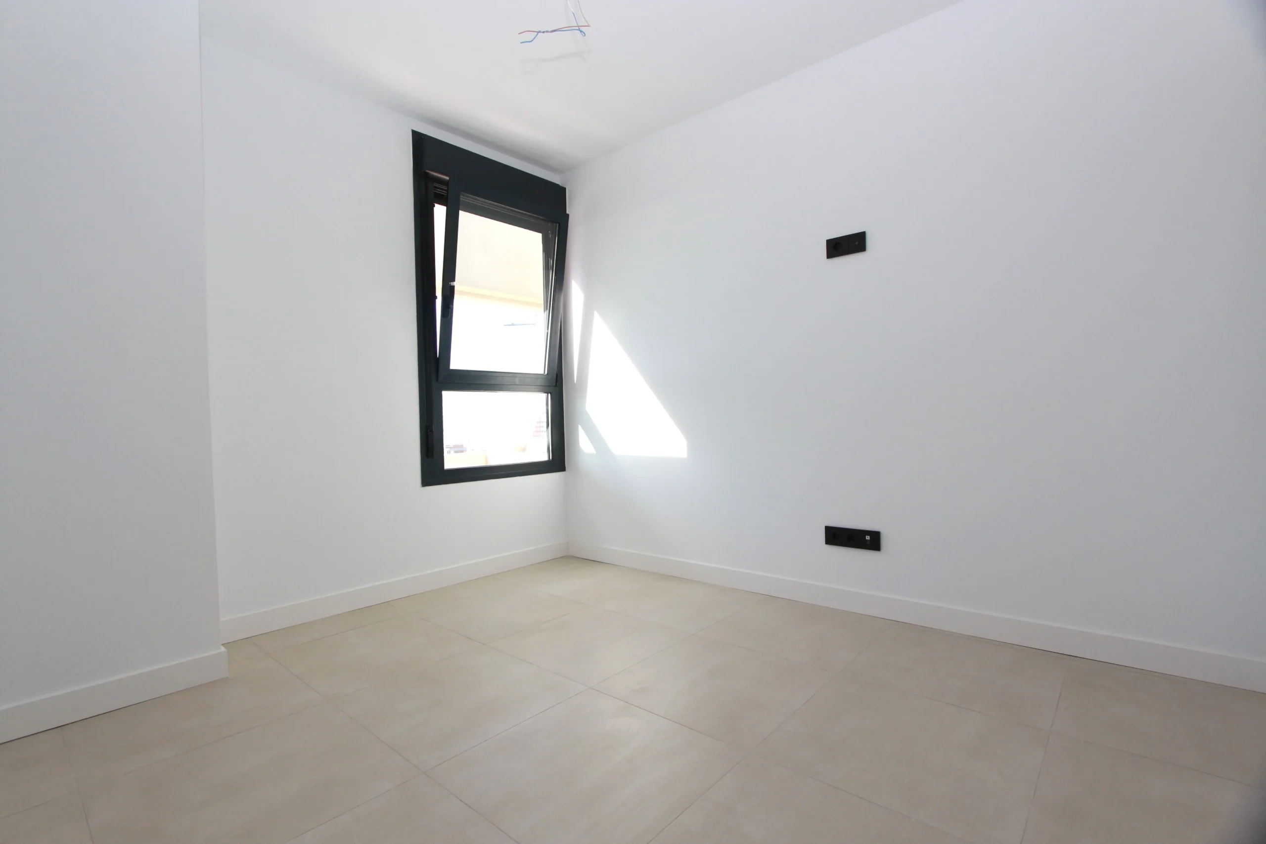 Bright bedroom inside modern luxury penthouse in Calpe