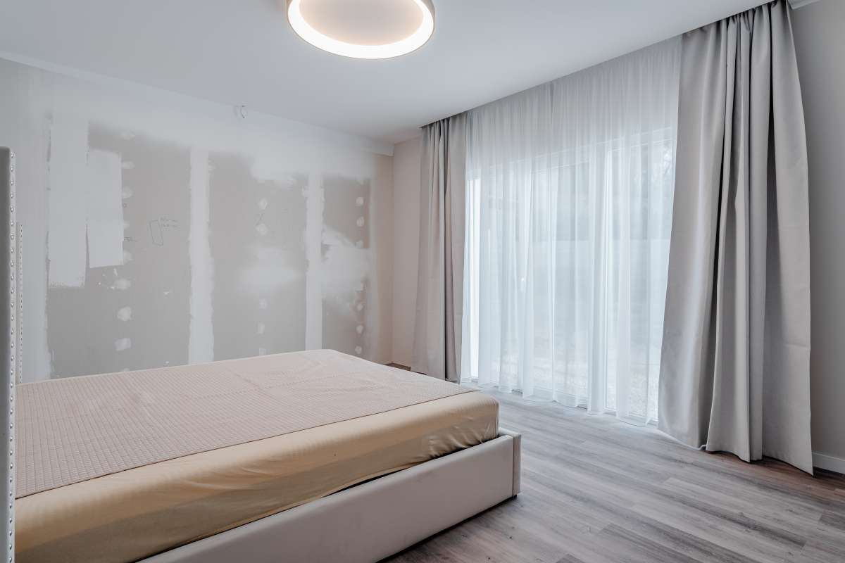 Bright bedroom with large window inside a modern new build villa for sale in Calpe