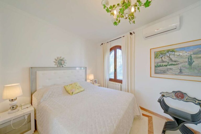 Bright bedroom with traditional details inside a second line Mediterranean villa near Puerto Blanco in Calpe.