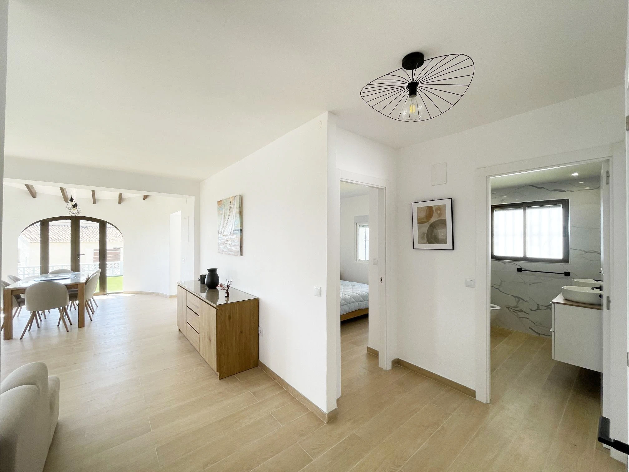 Bright interior hallway with bathroom access at villa in Oltamar, Calpe