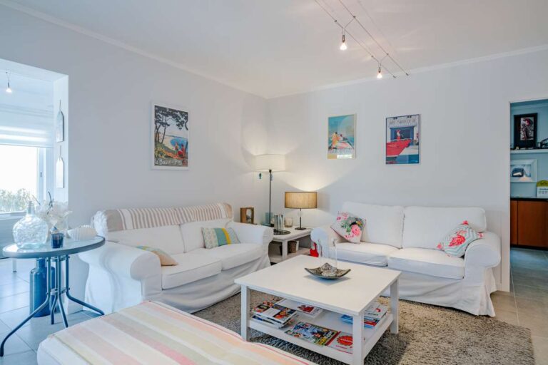 Bright lounge area inside a modern villa in Calpe with sofa seating, coffee table and natural light