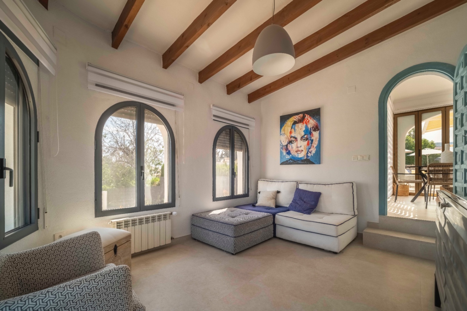 Bright lounge with arched windows at renovated villa in Calpe