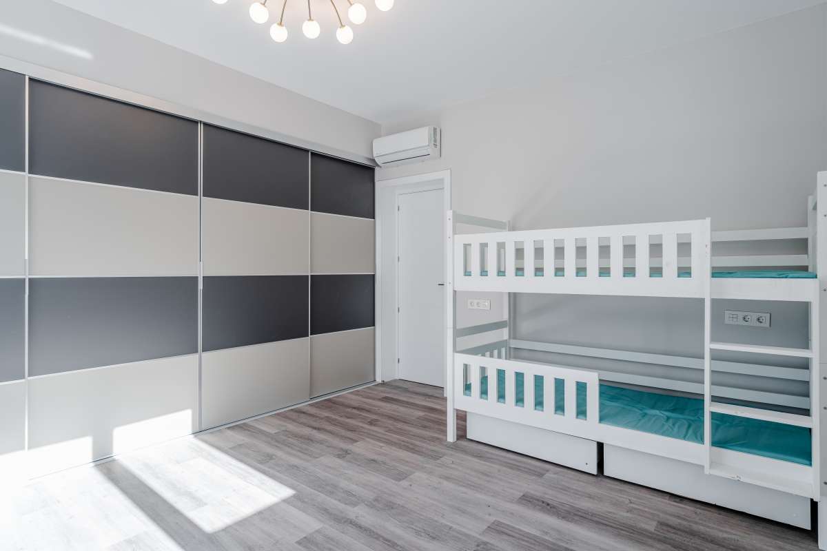 Children’s bedroom with bunk beds and natural light inside a new build villa for sale in Calpe