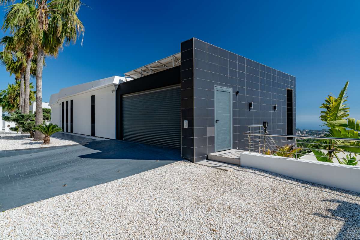 Closed garage and exterior entrance area at a luxury modern villa in Gran Sol, Calpe.