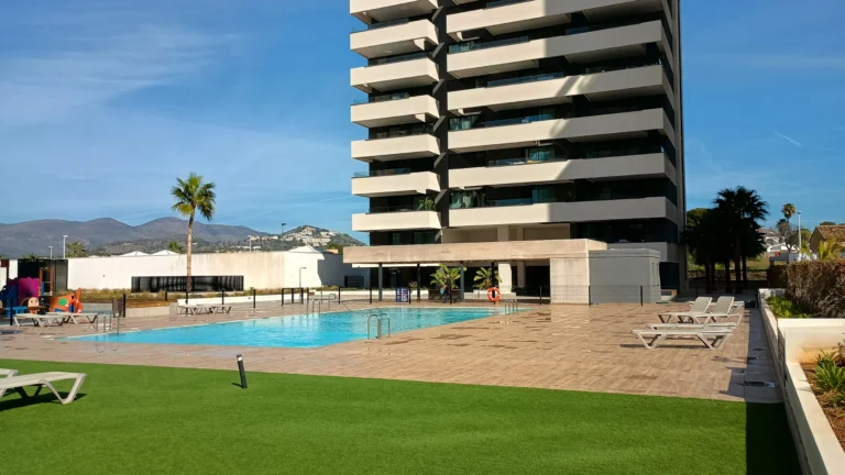 Communal pool and gardens at modern luxury penthouse complex in Calpe