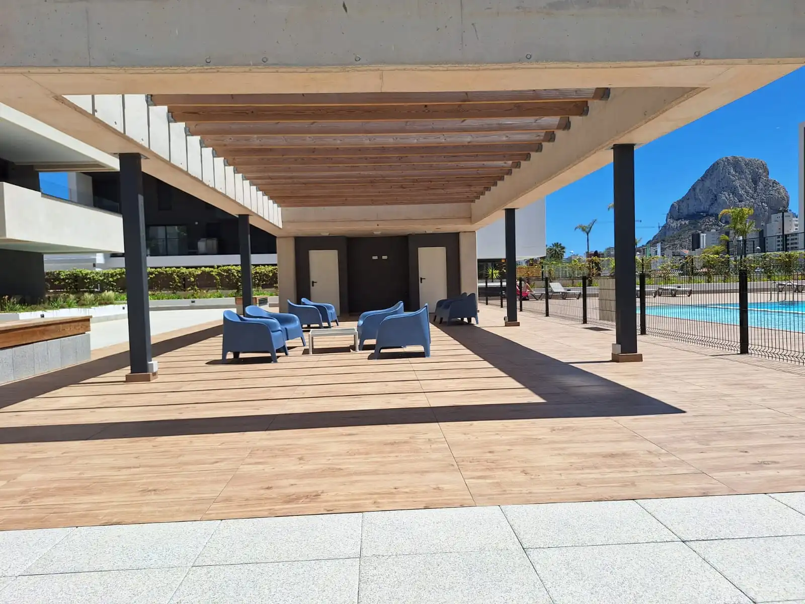 Covered communal terrace with views towards the Peñón de Ifach at penthouse complex in Calpe