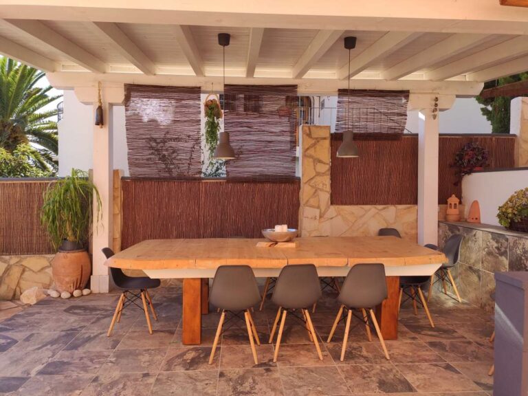 Covered outdoor dining area beside the pool at a refurbished villa with sea views in Canuta, Calpe.