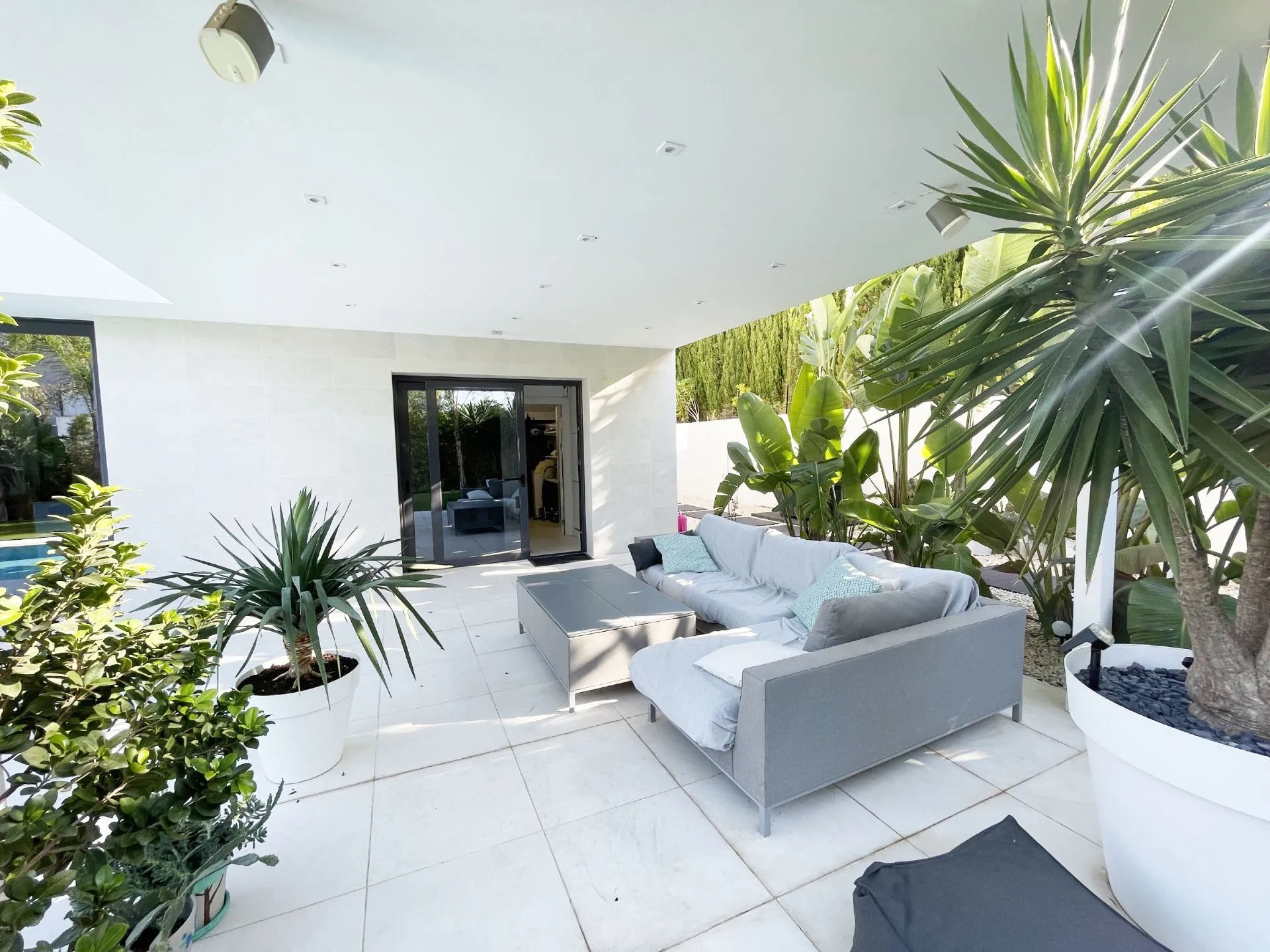 Covered outdoor lounge at modern villa in Calpe