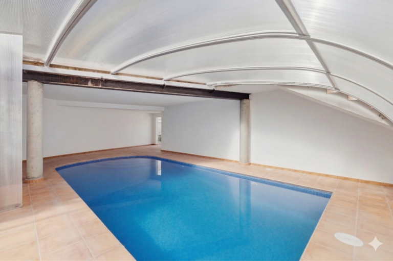 Covered swimming pool at a Mediterranean villa in Benissa Costa near Cala Baladrar with tiled terrace and enclosed pool structure